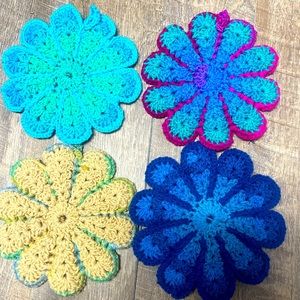 Knitted retro flower hotplate/potholders. Set of four in primary colors.